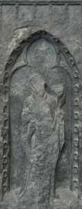 Photo of the weeper of the funerary monument in its current degraded state.